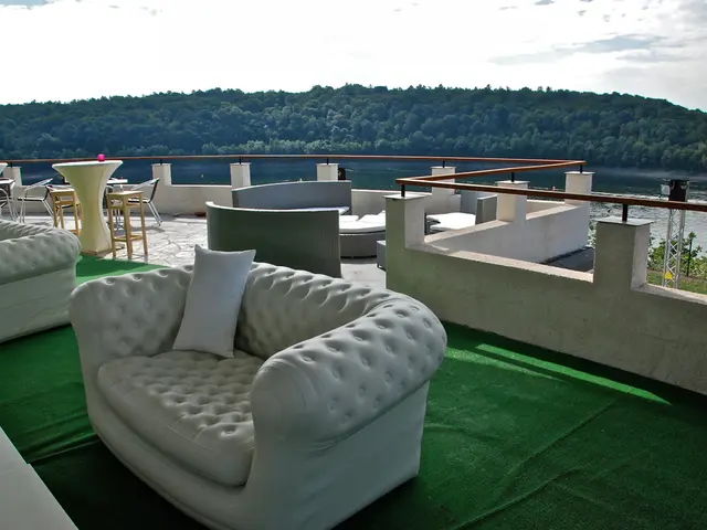 Shay Mitchell's living room lounge chair, marked as the best of the decade, boasts stylish...