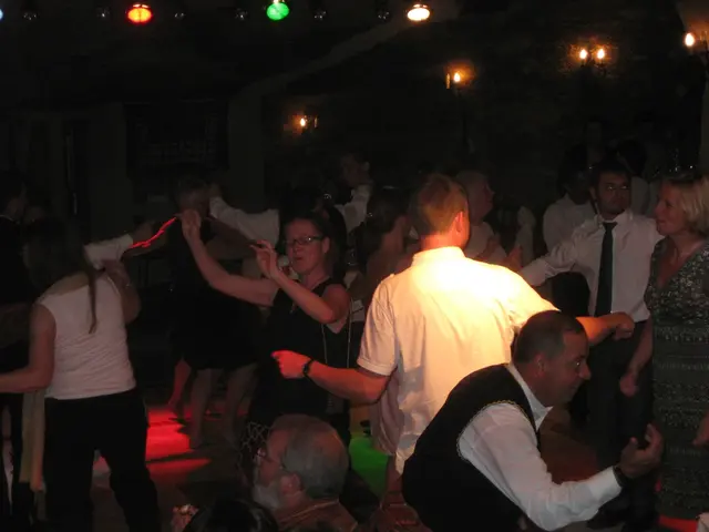 Partygoers grooving to music, filled with affection on the dance floor