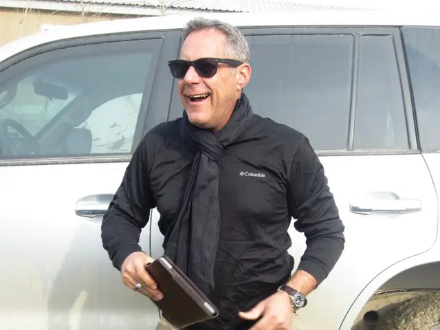 Individual employs mobile crane to demonstrate transitory nature of garden shelter