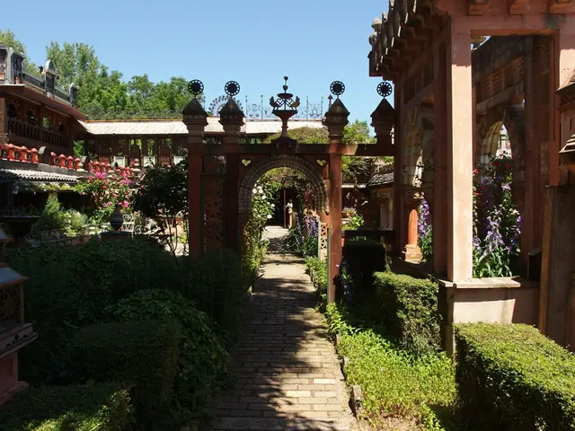 This is the picture of a place where we have some houses and around there are some trees, plants...