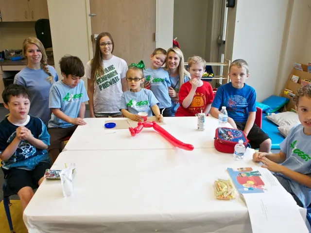 In this image I see number of children and 3 women over here and few of them are smiling. In the...