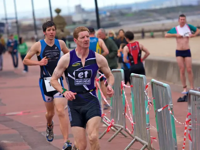 In this image on the left side we can see two persons are running on the footpath and there are...